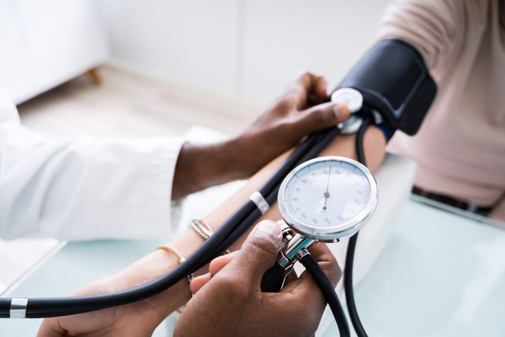 doctor reading blood pressure