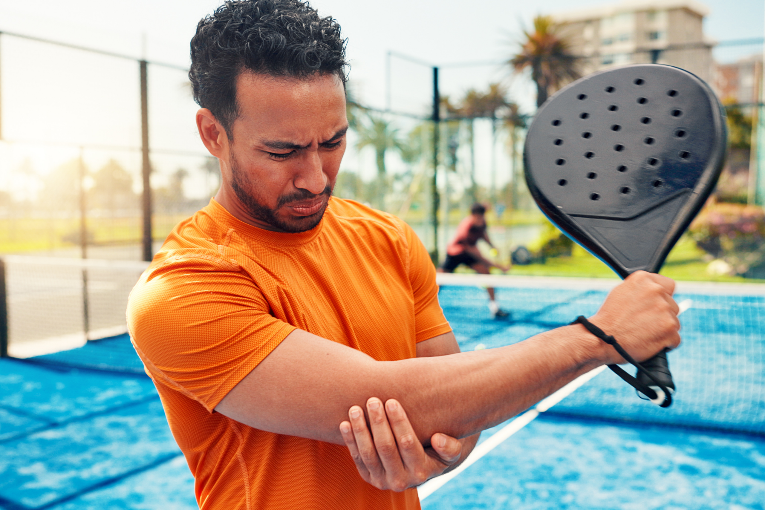 man with an arm injury while playing sports
